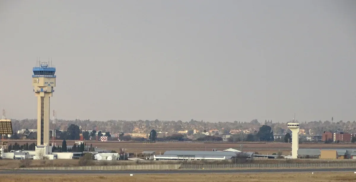 The control tower at OR Tambo International Airport above the runway approach roads