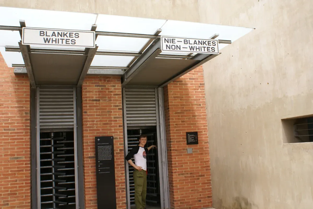 The segregated entrance at the Apartheid Museum, where each ticket's race classification decides which door you enter