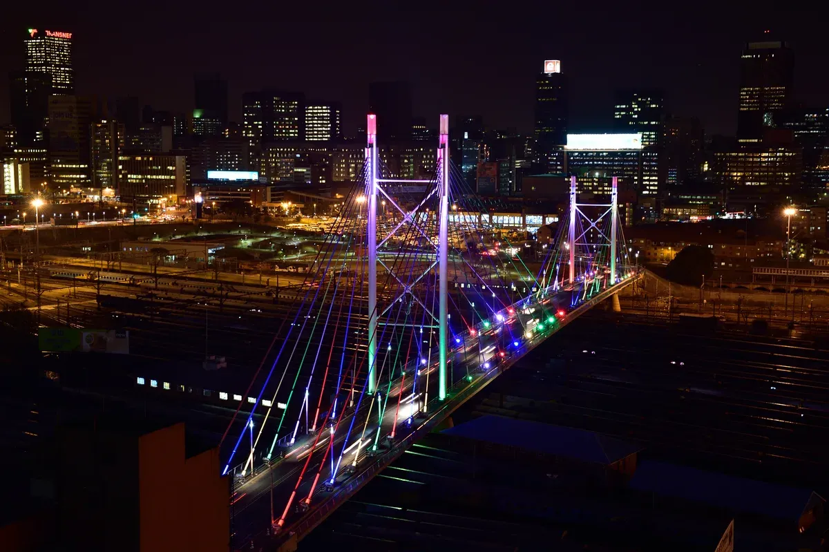The Nelson Mandela Bridge in Johannesburg with the city skyline behind it