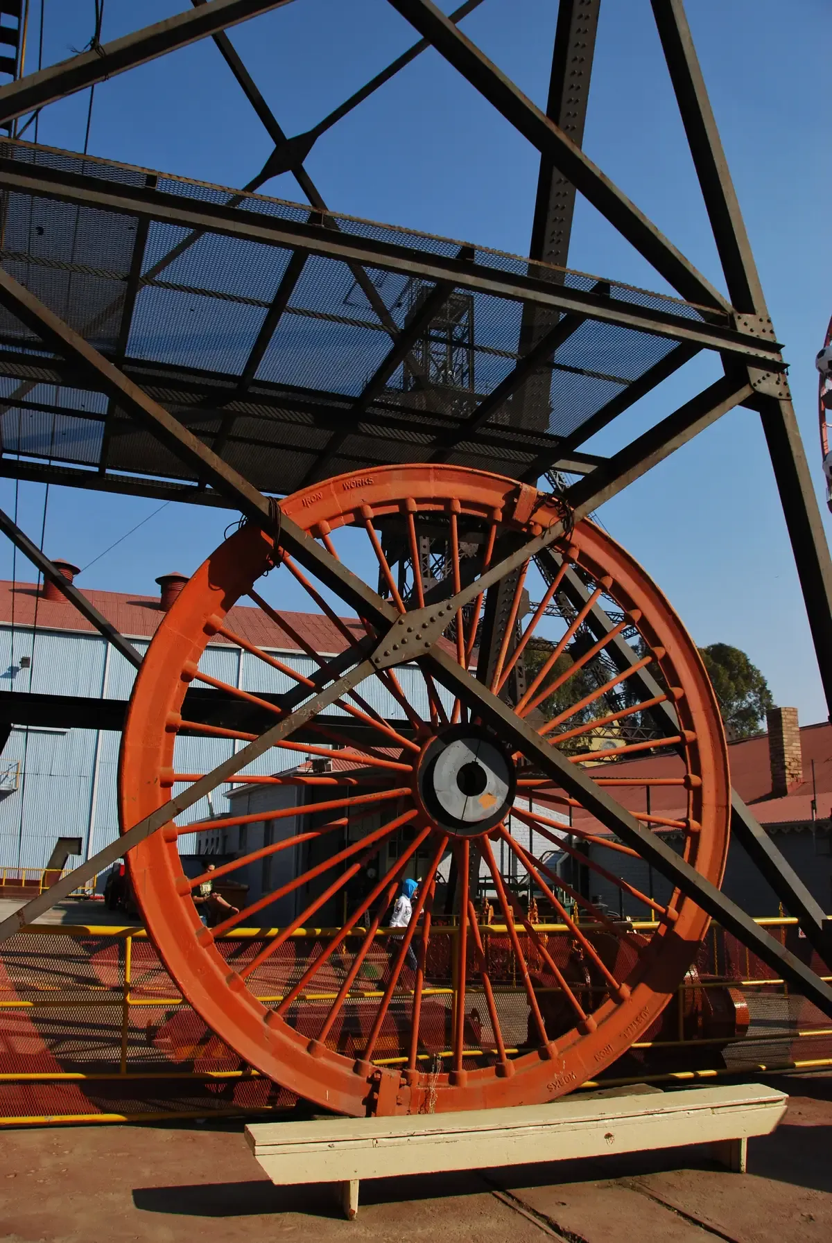 The underground tunnel of the Gold Reef City mine tour, with the old drilling equipment lit along the walls