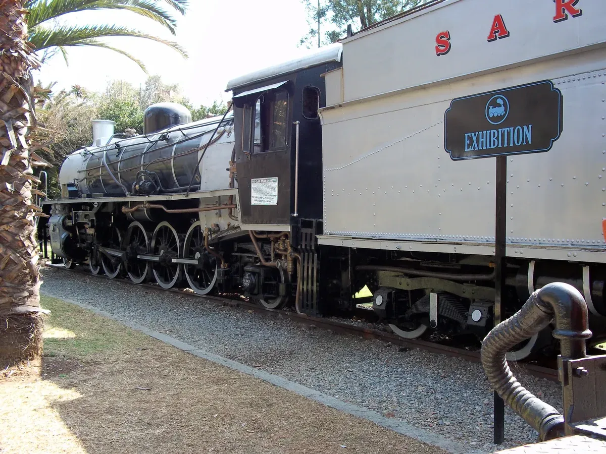 A preserved Class 19D steam locomotive numbered 3345 standing in the shed at Gold Reef City