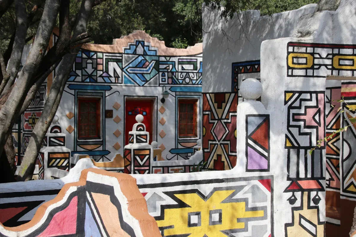 Ndebele homestead with geometric painted walls at Lesedi Cultural Village