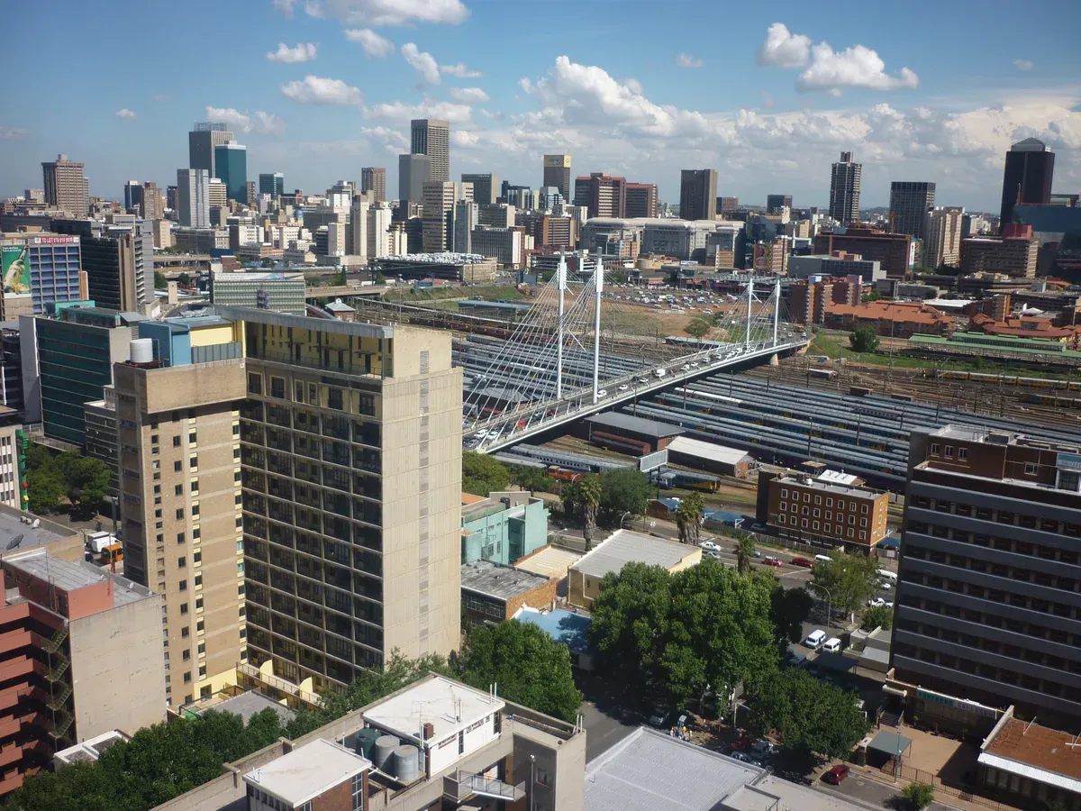 The Johannesburg CBD skyline seen from the east, the high ground where the city's oldest pins cluster